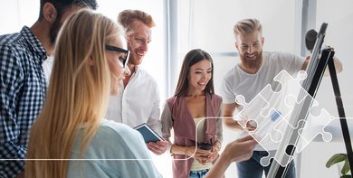 A group of people in front of a flipchart