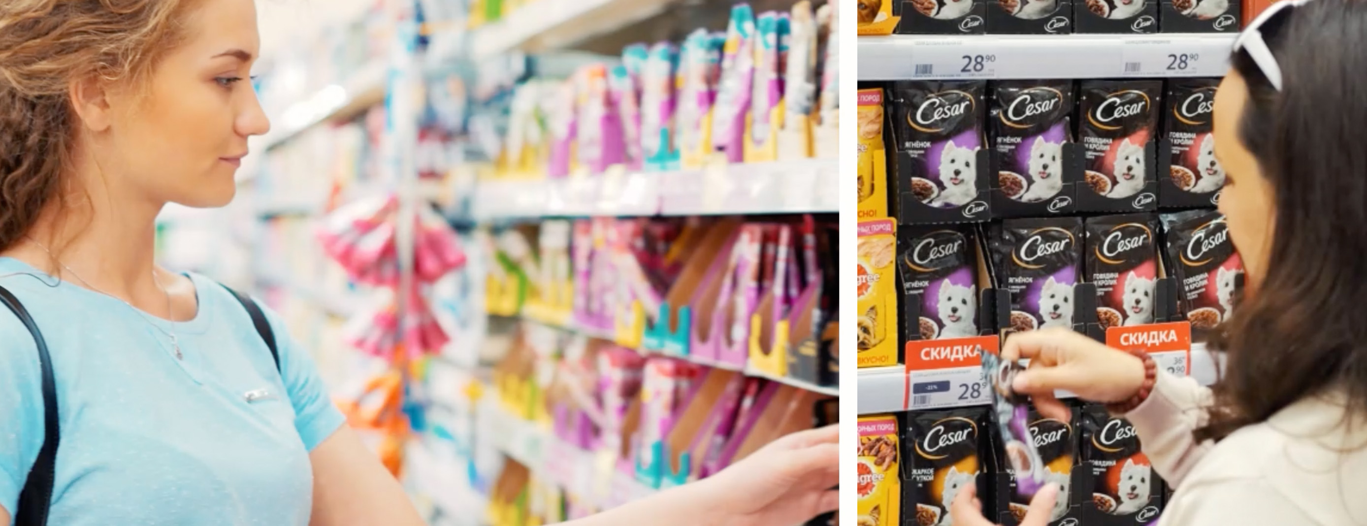 Eine junge Frau steht vor einem Supermarktregal und sieht ein Produkt an